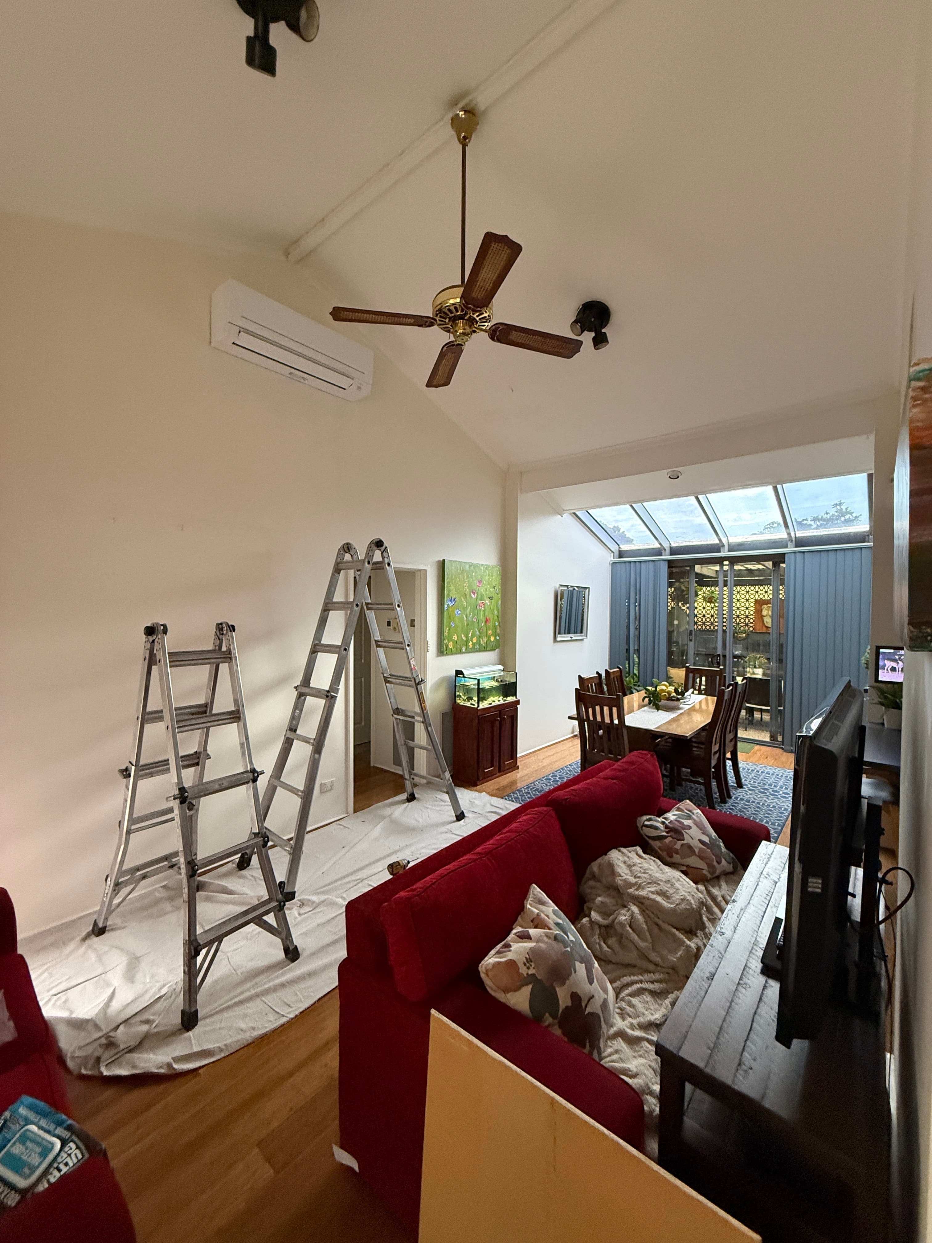 Wall-mounted split-system indoor unit in a living area during installation.